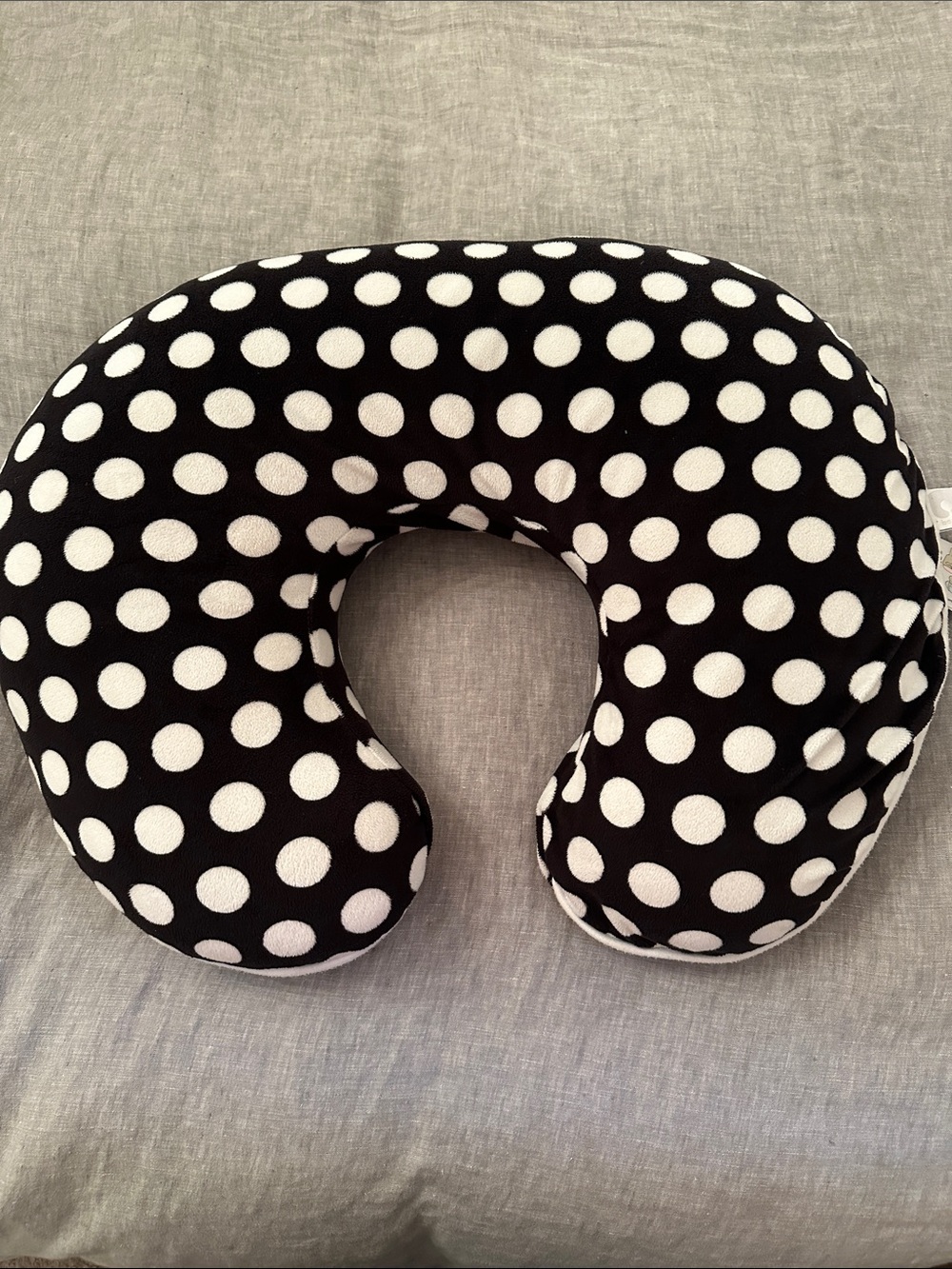 Black and white polkadot boppy infant support pillow with cover